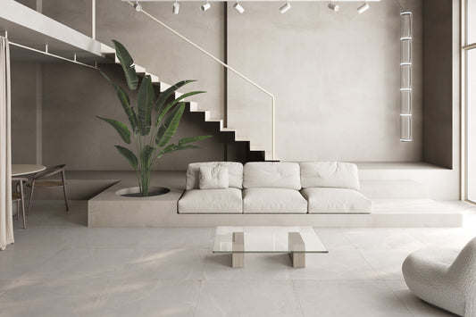 Modern living room with a white sofa, coffee table, and potted plant. Modern bathroom and living with 600x600 Palermo Marble Stone Look tile walls and floors. Melbourne, Geelong, Shepparton, Ballarat, Bendigo, Mornington, Bellarine, Peninsula tiles. Victoria and Nationwide Delivery. Australia.