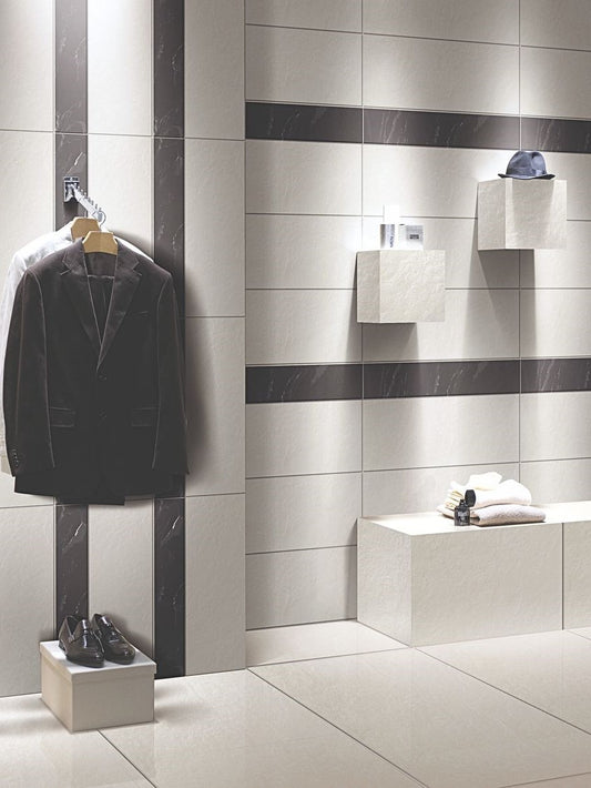 Modern bathroom interior with tiled walls and a suit hanging on a rack. Modern bathroom and living with 300x600 Costa Rock Face Stone Look Bacchus tile walls and floors. Melbourne, Geelong, Shepparton, Ballarat, Bendigo, Mornington, Bellarine, Peninsula, Lara, Melton, Sunbury, Warrnambool tiles. Victoria and Nationwide Delivery. Australia.