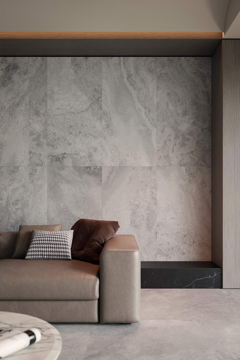Modern living room with a gray sofa against a textured wall. Modern bathroom and living with 600x600 Travertine look tile walls and floors. Melbourne, Geelong, Shepparton, Ballarat, Bendigo, Mornington, Bellarine, Peninsula tiles. Victoria and Nationwide Delivery. Australia.