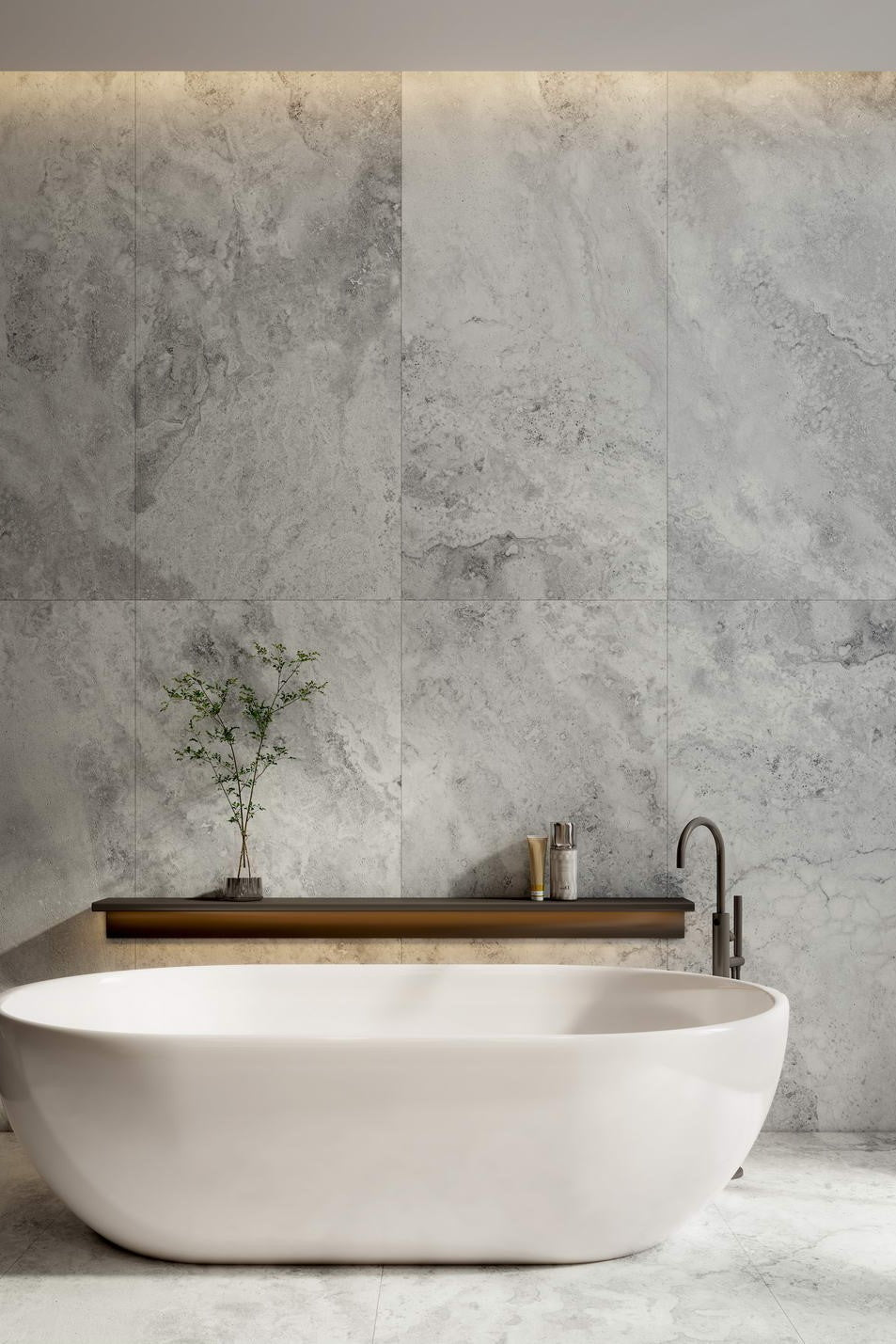 Modern bathroom with a freestanding bathtub against a gray tiled wall. Modern bathroom and living with 600x600 Travertine look tile walls and floors. Melbourne, Geelong, Shepparton, Ballarat, Bendigo, Mornington, Bellarine, Peninsula tiles. Victoria and Nationwide Delivery. Australia.