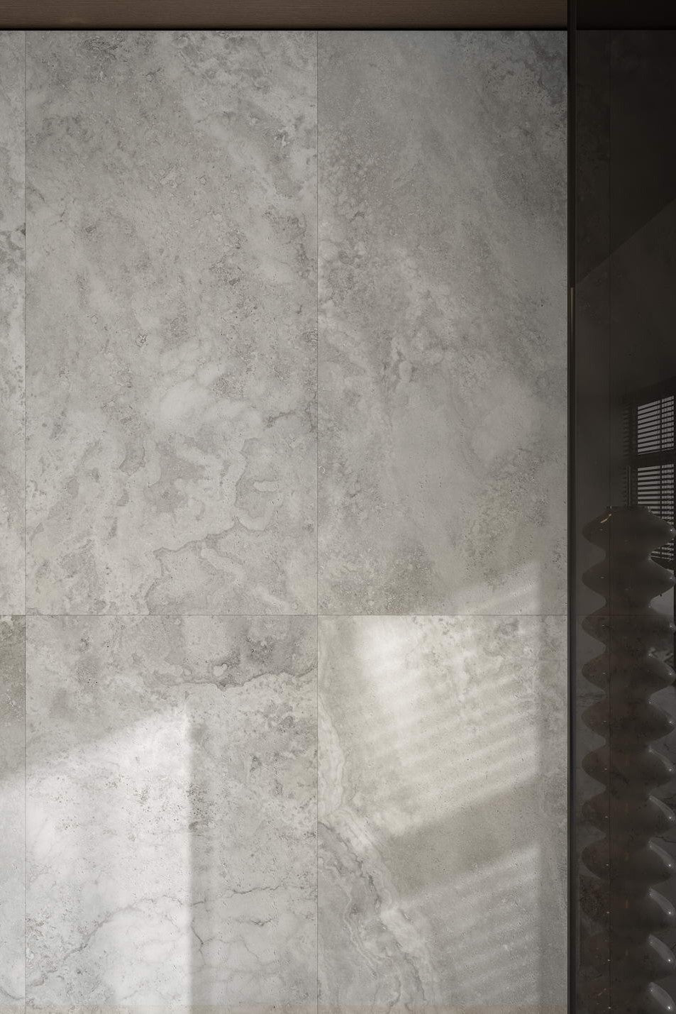 Gray tiled wall with a textured pattern. Modern bathroom and living with 600x600 Travertine look tile walls and floors. Melbourne, Geelong, Shepparton, Ballarat, Bendigo, Mornington, Bellarine, Peninsula tiles. Victoria and Nationwide Delivery. Australia.