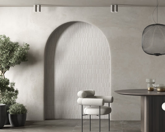 Modern interior with a curved wall, chair, and table. Modern bathroom and living with 300x900 Palermo Tessere Marble Stone Look tile walls and floors. Melbourne, Geelong, Shepparton, Ballarat, Bendigo, Mornington, Bellarine, Peninsula tiles. Victoria and Nationwide Delivery. Australia.