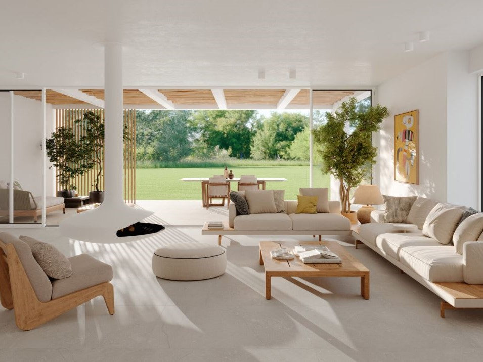 Modern living room with white furniture, large windows, and outdoor view. Modern bathroom and living with 600x600 Pietra Di Sicilia Stone Look Matt Tiles by Marazzi. Melbourne, Geelong, Shepparton, Ballarat, Bendigo, Mornington, Bellarine, Peninsula, Melton, Lara, Sunbury, Warrnambool, Horsham tiles. Victoria and Nationwide Delivery. Australia.