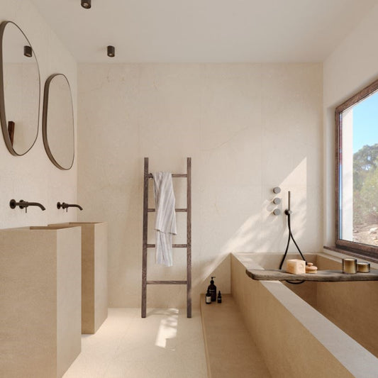 Modern bathroom with a bathtub, sink, and towel rack. Modern bathroom and living with 600x600 Pietra Di Sicilia Stone Look Matt Tiles by Marazzi. Melbourne, Geelong, Shepparton, Ballarat, Bendigo, Mornington, Bellarine, Peninsula, Melton, Lara, Sunbury, Warrnambool, Horsham tiles. Victoria and Nationwide Delivery. Australia.