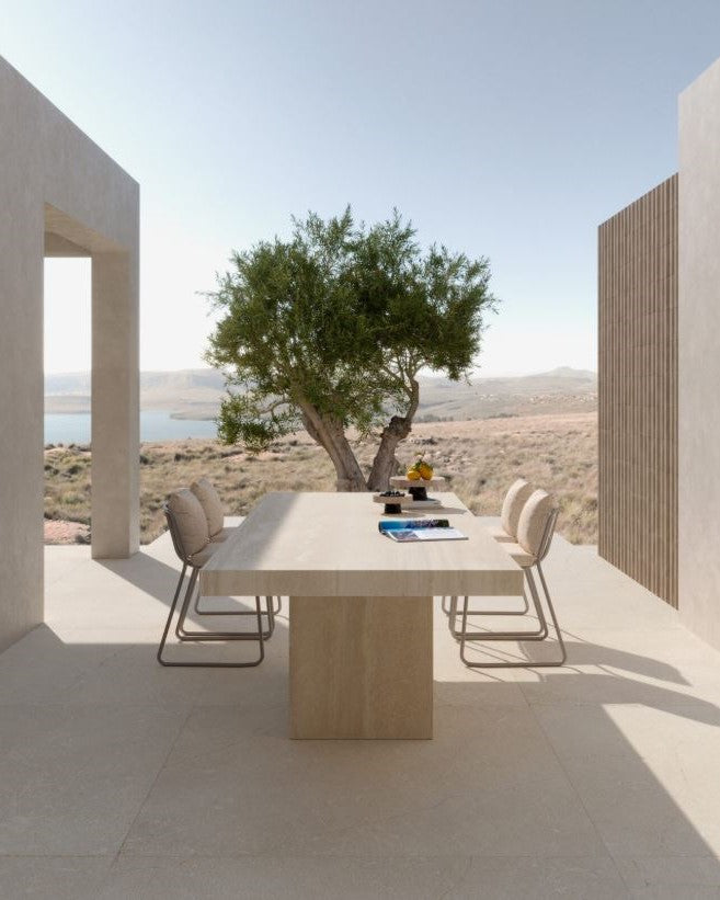 Modern outdoor dining area with a table and chairs in a scenic location. Modern bathroom and living with 600x600 Pietra Di Sicilia Stone Look Matt Tiles by Marazzi. Melbourne, Geelong, Shepparton, Ballarat, Bendigo, Mornington, Bellarine, Peninsula, Melton, Lara, Sunbury, Warrnambool, Horsham tiles. Victoria and Nationwide Delivery. Australia.