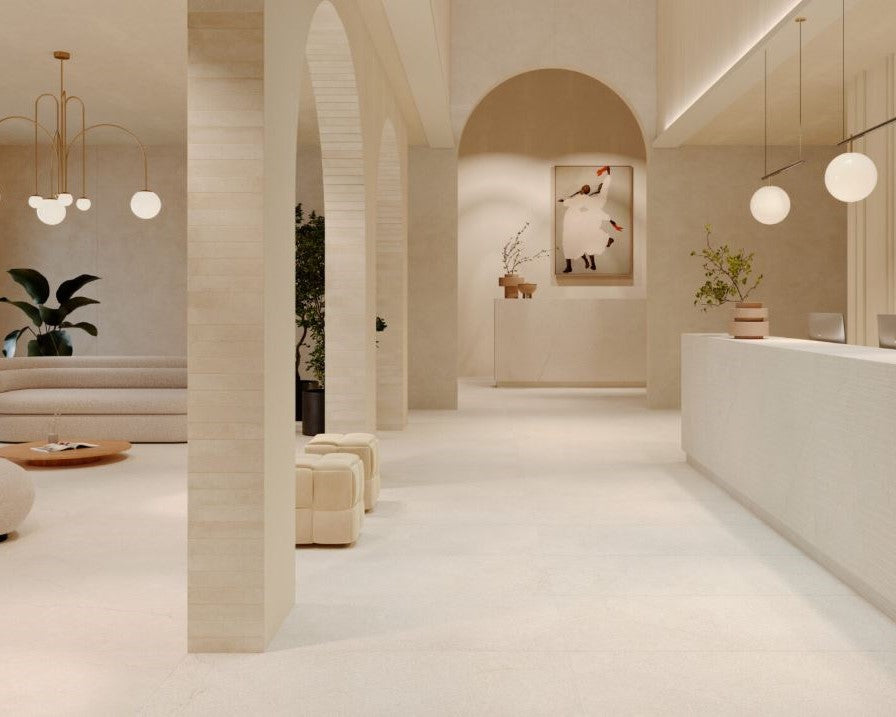 Modern interior design with neutral tones, arches, and minimal decor. Modern bathroom and living with 600x600 Pietra Di Sicilia Stone Look Matt Tiles by Marazzi. Melbourne, Geelong, Shepparton, Ballarat, Bendigo, Mornington, Bellarine, Peninsula, Melton, Lara, Sunbury, Warrnambool, Horsham tiles. Victoria and Nationwide Delivery. Australia.